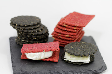 colorful crackers topped with cheese