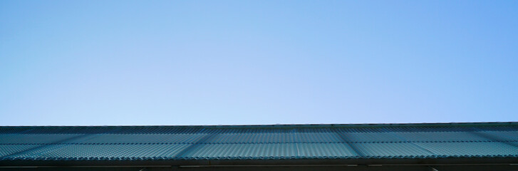 Fototapeta na wymiar Light blue sky and French blue wall