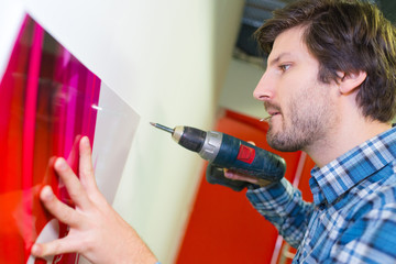 man drilling with drill perforator