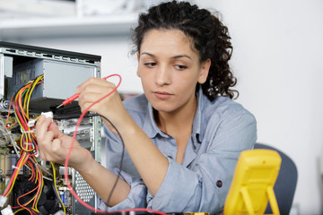 a woman testing a motherboard