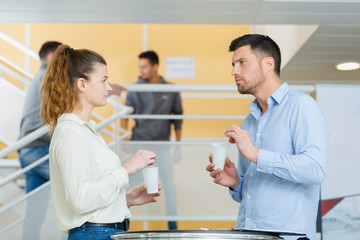 portrait of student talking to teacher