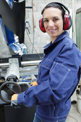 woman with protective ear plugs and helmet