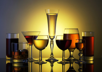 glasses and wine glasses with alcoholic and non-alcoholic drinks.