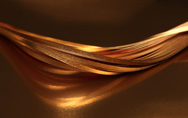 Abstract strip line background. Gold (bronze) wave on black.