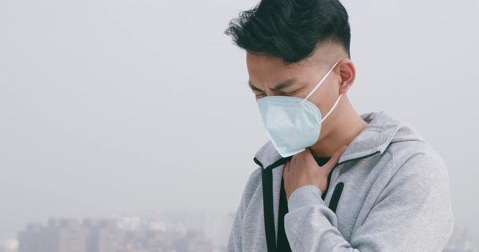 man sore throat with mask