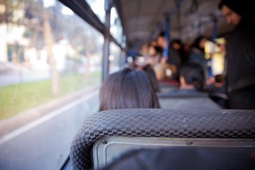 bus in Selective focus and blurred background. s the main mass transit passengers in the bus. People in old public bus, view from inside the bus .