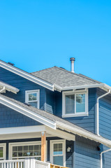 The roof of the house with nice window.