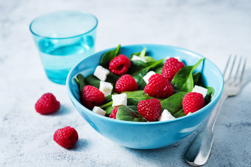 Spinach raspberry Feta salad in a bowl