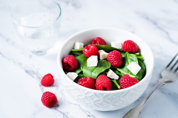 Spinach raspberry Feta salad in a bowl