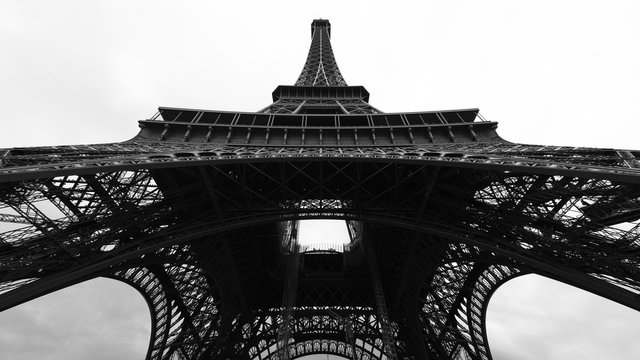 Eiffel Tower, Paris, France. View from below. Black and white photography.