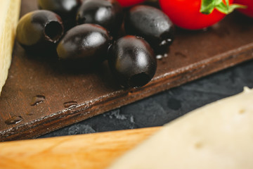 Black olives close up, ingredients to pizza cooking