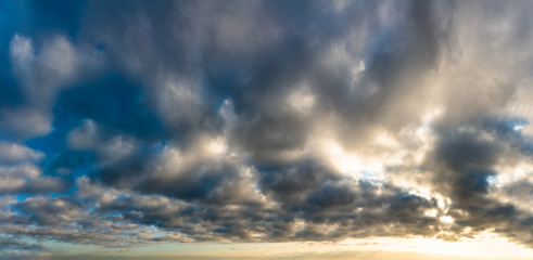 Obraz premium Fantastic dark thunderclouds at sunrise