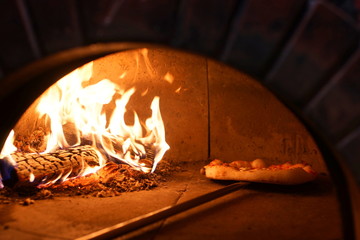 Neapolitan pizza cooked in a wood oven