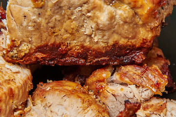 baked meat cut into pieces close up photo