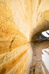 Close up of colorful texture of rocky surface in Cappadocia pigeon valley. Geological formations in and tunnels in Goreme.