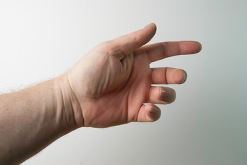 the right and left hand of a person trying to reach or grab something. throw, touch sign. I reach out to the left. isolated on a white background