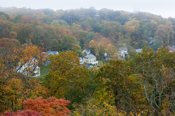A view of the houses in the Atlantic Highlands, as seen from the Twin Lights in Autumn. - 323072879