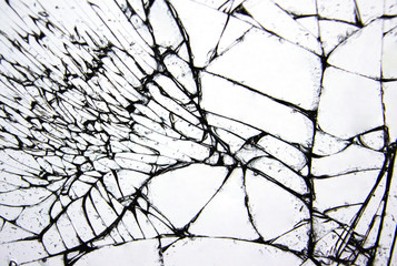 Cracks and lines on broken glass from impact.
