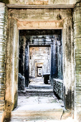 Fototapeta na wymiar Ruins of a temple in the jungle near Angkor Wat, Siem Reap, Cambodia