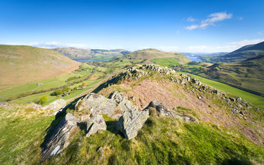 Fototapeta na wymiar Views of Hallin Fell from Howstead Brow above Boredale Beck and Ramps Gill with Ullswater in the distance in the Lake District Uk.