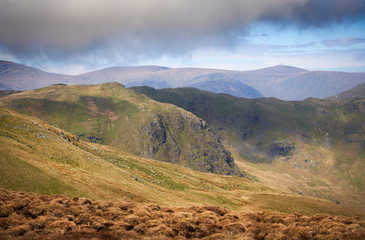 Views of the mountain ridge of Beda Fell, Heck Crag in the distance on a bright day in the Lake District UK.