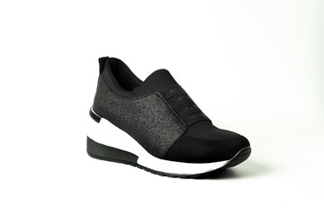 women's heeled shoes, flat sole sports shoes, patent leather shoes on a white background