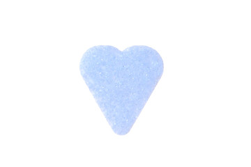 Blue heart made from pressed sugar on a white background