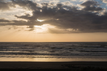 Naklejka na ściany i meble Sonnenuntergang am Muriwai Beach, Auckland