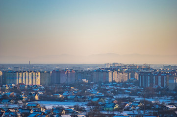 Winter city houses in haze