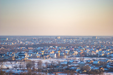 Winter city houses in haze