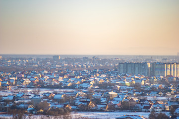 Winter city houses in haze