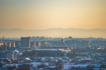 Winter city houses in haze