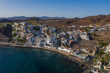 Fototapeta premium Fuerteventura holidays - scenic coastal village Gran Tarajal, Canary islands. Aerial drone view in october 2019