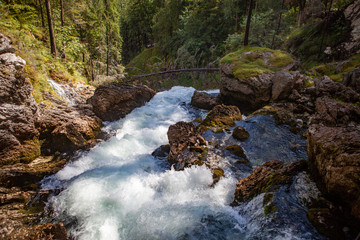 Stormy mountain river on a sunny day