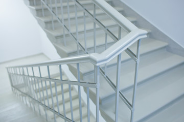 A white stairs up ladder in a new office building