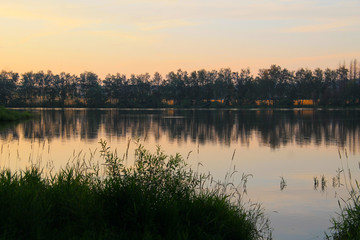 Obraz na płótnie Canvas dam and colorful skies reflecting on its calm surface in Zdar nad Sazavou, Czech Republic