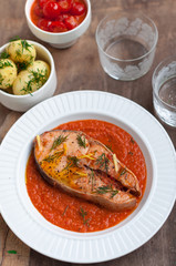 Wild Salmon Steak with Roasted Tomato Sauce Garnished with Dill and Lemon Zest