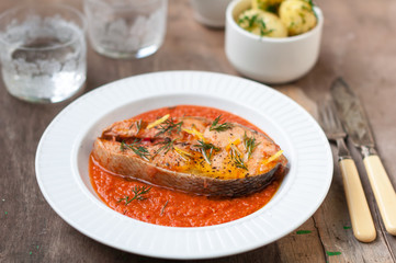 Wild Salmon Steak with Roasted Tomato Sauce Garnished with Dill and Lemon Zest