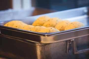 Bolinhos de Bacalhau – Portugal’s Popular Fried Cod Fish Cakes, process of cooking fried cod fish cakes, streets of Porto, Norte region, Portugal