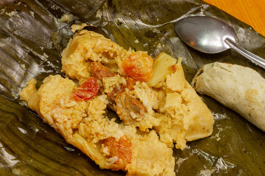 Nacatamal typical Nicaraguan food, corn, meat, butter, potatoes, onion, wrapped banana leaf