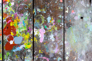 Wooden boards covered in paint creating random and abstract artistic patterns and shapes for creative background