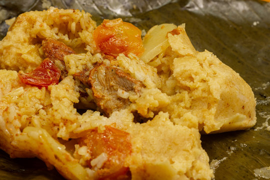 Nacatamal typical Nicaraguan food, corn, meat, butter, potatoes, onion, wrapped banana leaf