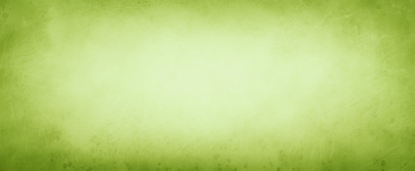Old pastel green paper parchment background design with distressed vintage stains and ink spatter and white faded shabby center, elegant antique green color
