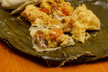 Nacatamal typical Nicaraguan food, corn, meat, butter, potatoes, onion, wrapped banana leaf