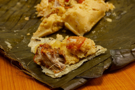 Nacatamal typical Nicaraguan food, corn, meat, butter, potatoes, onion, wrapped banana leaf