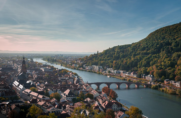 Heidelberg's view from the castle, historical village along the river and a bridge with a background of woods on a hill