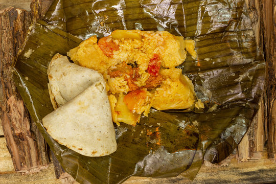Nacatamal typical Nicaraguan food, corn, meat, butter, potatoes, onion, wrapped banana leaf