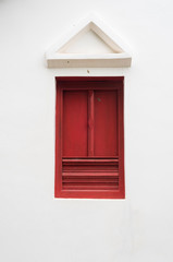 Vintage wooden window in red colour in Thai style