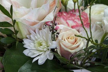 Close-up bright floral arrangement in pastel colors in a hat box, greeting concept