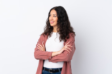 Spanish Chinese woman over isolated white background looking to the side